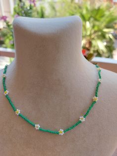 A pretty necklace perfect for everyday wear. So cute and dainty this layering necklace looks lovely on it's own on layered with other necklace. Daisy beaded necklace is an excellent and elegant gift for your lovelies. Choker necklace is made of white and green bead. You can wear the seed bead necklace to a wedding party and look very special. This tiny choker is made of glass beads. Please select necklace length from the drop-down menu or request an arbitrary length. If you would like a bigger/smaller size please contact me. You can press the contact button. Summer Beaded Necklaces With Flower Charm As Gift, Summer Gift Beaded Necklace With Flower Charm, Beaded Flower Necklace For Summer Gifts, Summer Flower Beaded Necklaces, Summer Flower Necklace With Tiny Beads, Summer Flower Necklace With Tiny Round Beads, Summer Beach Flower Necklace With Flower Charm, Summer Beach Flower Necklace With Charm, Summer Beach Flower Charm Necklace