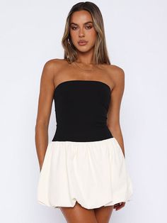 Features: Explore your feminine side with the Joan Ruffled Contrast Slin Mini Dress. This fashion-forward dress features a high waist and patchwork design, perfect for showing off your curves. The strapless and backless design adds a touch of sexiness to your summer wardrobe. Stand out and make a statement with this new must-have dress. Chic Backless Tube Top For Summer, Chic Bandeau Tube Top For Brunch, Chic White Tube Top For Date Night, Chic White Stretch Strapless Dress, Fitted Black Strapless Dress For Day Out, Black Fitted Strapless Dress For Day Out, Chic Strapless Bandeau Dress For Brunch, Chic White Backless Tube Top, Chic White Bandeau Strapless Dress