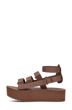 This sporty gladiator sandal revamp is boosted by a chunky platform sole, hook-and-loop closures and a removable ankle strap for added versatility. 1 3/4" platform Textile and leather upper and lining/rubber sole Imported Brown Synthetic Sport Sandals With Adjustable Strap, Brown Casual Sport Sandals With Double Strap, Casual Brown Sport Sandals With Adjustable Strap, Brown Sport Sandals With Adjustable Straps, Adjustable Ankle Strap Brown Sport Sandals, Brown Synthetic Sport Sandals With Buckle Closure, Brown Synthetic Sport Sandals With Buckle, Brown Adjustable Sport Sandals, Chunky Platform