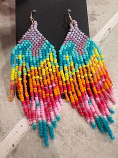 Hand made with love in Montana. The beautiful vibrant colors of this pair are like a Montana sunset over the mountains. Montana Sunset, Fringe Earring, Fringe Earrings, Made With Love, Beaded Earrings, Montana, Jewelry Earrings Dangle, With Love, Dangle Drop Earrings