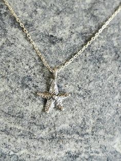 "Tiny sterling silver starfish pendant. The sterling silver charm is a dainty 9mm with a shiny finish. It has a delicate sterling silver chain and clasp. Shown here in 17\" length. *If you are unsure of the length you need, or would like to wear this item at different lengths, we now offer an adjustable length option! You can add an adjustable end to your necklace using this link: https://www.etsy.com/listing/791277751/necklace-extension-added-to-your All items are gift wrapped and shipped witho Necklace Extension, Starfish Pendant, Starfish Necklace, Solid Gold Jewelry, Jewelry Cleaner, Necklace Sterling Silver, Sterling Silver Charm, Santa Barbara, Silver Charms