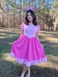 Our Sleeping Beauty dress features two shades of pink in a romantic and delicate pattern. It makes a perfect Disneybound piece, just add your favorite princess Aurora accessories and you will look amazing at the parks! Ruffled bottom. Ballgown puffy sleeves. It has pockets. Soft 95% cotton and 5% spandex. Pink Fairytale Dress For Spring, Pink Princess Dress With Puff Sleeves, Pink Fairytale Princess Dress With Ruffles, Pink Fairytale Dress For Dress-up, Pink Short Sleeve Princess Dress For Dress-up, Pink Puff Sleeve Princess Dress For Dress-up, Whimsical Pink Short Sleeve Dress, Pink Short Sleeve Princesscore Dress, Pink Minnie Mouse Dress For Spring