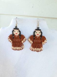 Native American Style Beaded Indian Doll Earrings in Buckskin | Etsy Brick Stitch Native American, Beaded Key Chains Native American, Native American Beadwork Earrings, Inuit Beaded Earrings, Native American Beaded Earrings Inspire Uplift ⭐, Doll Earrings, Litle Girls, Native American Kachina Dolls, American Gifts