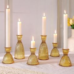 a group of candles sitting on top of a table