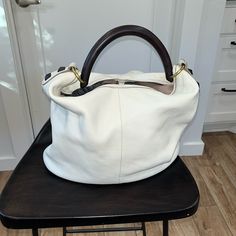 White Leather Shoulder Bag With Hard Carry Handle By J.Crew. Nwt. Approx 12” High And 14” Wide. Clip/Buckle At The Top Of The Bag To Hold It Closed. A Couple Of Small Marks On The Bottom From Storing The Bag In My Closet. White Everyday Bag With Handle Drop, White Hobo Bag With Double Handle, Modern White Bucket Bag With Gold-tone Hardware, Everyday White Satchel With Handle Drop, White Hobo Shoulder Bag With Handles, White Leather Bucket Bag With Leather Handles, White Hobo Bag With Leather Handles For Travel, White Top Handle Hobo Bag, White Crossbody Hobo Bag For Errands