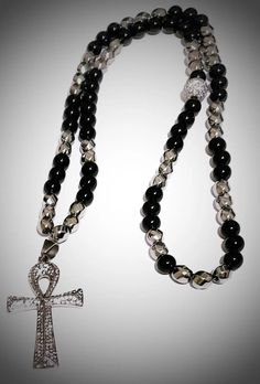 Black and Silver Ankh Necklace freeshipping - L.Signature Collection by L.Styles Ankh Necklace Aesthetic, Silver Spiritual Cross Beaded Necklace, Silver Cross Beaded Necklace For Spiritual Style, Silver Hematite Necklace With 8mm Beads, Silver Hematite Necklace With Gemstone Beads, Spiritual Silver Cross Beaded Necklace, Spiritual Cross Necklace With Polished Beads, Silver Beaded Necklace With Black Hematite Beads, Silver Hematite Beaded Necklace With Black Beads