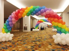 an arch made out of balloons on the floor