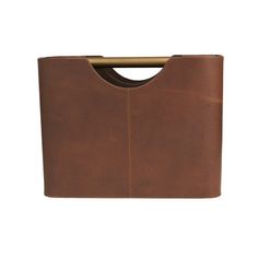 a brown leather bag with a gold handle