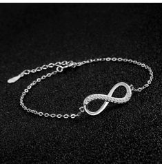 ♥ MATERIAL: 925 sterling silver and cubic zirconia. 925 Sterling Silver is the ideal metal material for making accessories thanks to its proven shine, brightness and strength. ♥ size: bracelet length: 15cm + 4cm (extension), infinity size: 2*1cm, weight: 1.8g. ♥ Infinity Design: Infinity symbol silver bracelet, simple and elegant design. Infinity means infinite love and friendship forever. It is an ideal gift for your good friend, lover or yourself. ♥ Packaging: Packed in a filigree gift box, it Elegant Silver Crystal Bracelets, Silver Infinity Bracelet With Adjustable Chain, Elegant Sterling Silver Crystal Bracelet As Gift, Sterling Silver Cubic Zirconia Bracelet For Anniversary, Sterling Silver Chain Bracelets For Party, Silver Crystal Tennis Bracelet As Gift, Sterling Silver Tennis Bracelet With Sparkling Stones As Gift, Sterling Silver Bracelet With Sparkling Stones In Diamond White, Diamond Bracelets With Silver Chain For Gift