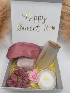 a gift box with hair accessories and a happy sweet 16 sign in the top right corner