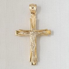 14k Yellow Gold and White Gold Crucifix Cross Two Tone Pendant. This Pendant is crafted from Solid 14K Yellow Gold and White Gold. Dimension is 7/8 in x 1-1/4 in (21 mm x 32 mm). The measurement is not including the bale. Weight Approx. is 3.40g Material  14K Yellow Gold Metal Type 14K Yellow Gold The quality is excellent. A perfect gift. Gold Feathers, Dog Pendant, Feather Pendant, Fine Jewellery Necklace, Sterling Silver Necklaces, Types Of Metal, Gold Metal, Jewelry Necklace Pendant, Two Tone