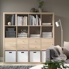 a living room filled with furniture and bookshelves