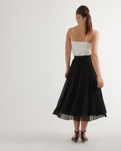 Flattering, flowy, and fully lined. Our high-rise midi skirt is lightweight and has an elastic waistband for a comfortable fit that you can wear all day. Made of low-maintenance, wrinkle-resistant fabric.  | Quince | Women's Chiffon Pleated Midi Skirt in Black, Size Large, 100% Polyester Cashmere Robe, Silk Tee, Floor Length Skirt, Knit Blazer, Skirt Fits, Silk Tank, Blue White And Black, Sheer Chiffon, Beautiful Skirts