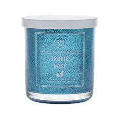 a candle that is blue and has the words tropic mist on it