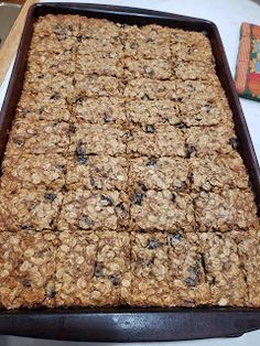 a pan filled with granola sitting on top of a table