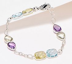 Keeping up with your fab sense of style, this multi gemstone bracelet adds effortless elegance to any ensemble (and a splash of color!). Multicolor Sterling Silver Bracelets With Stones, Sterling Silver Multicolor Stone Bracelets, Multicolor Natural Stones Bracelet In Sterling Silver, Multicolor Stone Bracelets In Fine Jewelry Style, Multicolor Sterling Silver Beaded Bracelets, Multicolor Stone Bracelets Fine Jewelry, Modern Multicolor Jewelry With Stones, Elegant Multicolor Gemstone Crystal Bracelet, Elegant Multicolor Crystal Gemstone Bracelet