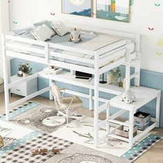 a white loft bed sitting on top of a wooden floor next to a desk and chair