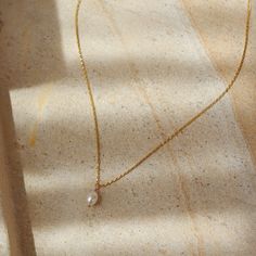 Featuring a delicate pearl and classic gold chain, this timeless piece adds a bit of romantic charm to your look. It's the perfect necklace to make your day just a little more special! DETAILS14k gold fill or sterling silver14", 16", or 18" lengths with a 1" clasp extender chain, Gemstone measures at 0.25"Hypoallergenic and waterproof Dainty Gold-plated Charm Necklace With Pearl Pendant, Delicate Pearl Chain Charm Necklace For Everyday, Everyday Delicate Pearl Chain Charm Necklace, Classic Gold Charm Necklace With Pearl Drop, Classic Gold Charm Necklace With Pearl Chain, Classic Gold Pearl Chain Charm Necklaces, Dainty Gold Plated Necklaces With Pearl Charm, Timeless Gold Pearl Necklace With Delicate Chain, Delicate Gold-plated Charm Necklace With Pearl Pendant