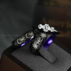 THIS LISTING IS FOR THREE (3) RINGS:  HER BAND: 6MM BLACK TUNGSTEN BAND = MOON  HER RING: 3MM .925 BLACK PLATED STERLING SILVER THREE STONE BAND PRONG SETTING (2 X WHITE DIAMOND CZ (3MM) & WHITE DIAMOND CZ (5MM)) AVERAGE WEIGHT: 4.8GMS QUALITY: AAAAA  HIS BAND: 8MM BLACK TUNGSTEN BAND = SUN  Need a custom size / design? contact us and we’ll make it for you.  Please get professionally measured for ring size and read our exchange policy carefully prior to ordering. Gothic Engraved Wedding Rings, Celestial Style Engraved Jewelry For Wedding, Mystical Engraved Wedding Jewelry, Celestial Style Engraved Wedding Jewelry, Engraved Moon Shaped Jewelry For Wedding, Engraved Moon Shaped Wedding Jewelry, Black Moon-shaped Sun And Moon Jewelry, Mystical Sun And Moon Design Jewelry For Wedding, Black Moon-shaped Jewelry With Sun And Moon Design