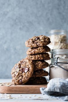 cookies stacked on top of each other next to a jar of oatmeal