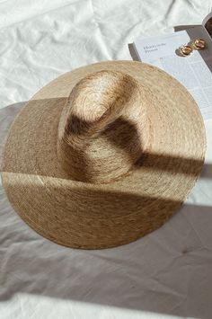 Lack of color Palma Wide Fedora is handmade by artisans in Mexico, our new 100% baked palm leaf hats are perfect for the Summer soiree of your choice. Featuring a cowboy crown and tightly woven pressed palm, this hat is made for Summer. Natural Palm Leaf wide-brimmed western hat 100% Palm Leaf in Natural Inner elastic sweatband to help with fitBrim measures approx. 12 cm / 4.7” Sits higher on head Spot / specialist clean This hat is accredited with a UPF Rating 50+ (Australian Tested) Please note, hat features including straw color and brim width may vary slightly from piece to piece. These hats are individually handcrafted by artisans, each with its own unique character. We want your new hat to be as unique as the person wearing it and consider this a contribution to the unique character Handmade Brimmed Boater Hat In Toquilla Straw, Artisan Woven Straw Hat For Summer, Artisan Panama Hat For Spring Beach, Artisan Panama Hat For Beach In Spring, Handmade Toquilla Straw Boater Hat, Artisan Style Fedora For Summer Rodeo, Artisan Fedora For Summer Rodeo, Artisan Fedora For Spring Vacation, Artisan Fedora For Beach In Spring