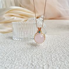 Embrace the gentle energy of love and healing with this handmade Rose Quartz 21mm Bead Pendant Necklace. The soft pink hues of the Rose Quartz beads radiate peace and harmony, while the stylish pendant adds a touch of elegance to any outfit. This necklace is perfect for those seeking to attract love and positive energy into their life, making it a meaningful gift for yourself or a loved one. Wear this beautiful piece as a daily reminder to open your heart to compassion and self-love. Product Det Pink Opal Round Beads Necklace For Gift, Handmade Pink Crystal Necklace As Gift, Handmade Pink Crystal Necklace For Gift, Pink Birthstone Round Pendant Necklace, Pink Spiritual Pendant Crystal Necklace, Spiritual Pink Pendant Crystal Necklace, Spiritual Pink Necklaces For Gifts, Pink Round Bead Necklaces For Mother's Day, Pink Beaded Necklaces For Mother's Day