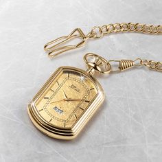 The pocket watch is a classic, elegant style. It has been around for hundreds of years and remains timeless and classy—the ultimate status symbol for men. A fancy rectangular case is set with a 24k gold foil dial that is sure to impress. A single solitaire Diamondeau®, flawless simulated diamond sits at 12 o’ clock and handy date window to keep you on track. Get yourself a piece of history with this gold foil pocket watch. Luxury Elegant Pocket Watch With Polished Finish, Classic Elegant Style, Status Symbol, Gold Pocket Watch, Latest Jewellery, Classic Elegant, Mens Gold, Signature Design, Gold Foil