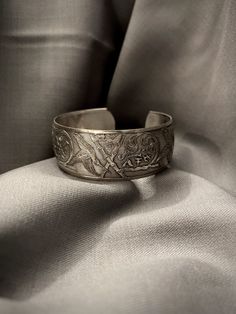 A vintage sterling silver bangle with hand engraved detailing  - Total weight: 21.8 grams - Total inside diameter: 2" inches, can be adjusted to be wider *Item worn, sold as is* Ornate Stamped Bracelets For Formal Occasions, Antique Engraved Cuff Bracelet For Anniversary, Antique Stamped Cuff Bracelet For Formal Occasions, Antique Engraved Cuff Bracelet For Formal Occasions, Engraved Antique Silver Cuff Bracelet For Weddings, Formal Engraved Bangle Cuff Bracelet, Engraved Antique Cuff Bracelet For Anniversary, Adjustable Engraved Bangle For Formal Occasions, Antique Sterling Silver Etched Bracelet For Formal Occasions