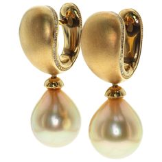 Golden South Sea Pearl Diamonds Drop Earrings Very comfortable earrings. Smooth design in combine with a smooth surface of a pearl gives perfect result. Brown diamonds carefully selected to support the pearl color. Pure triumph of Golden!!! Please request a video to check this earrings in action. 10.3x33.4mm (WxL) Earrings weight - 13.39gm Accompanied with the Ring LU116414800383 Bling Things, South Sea Pearls Earrings, Yellow Gold Drop Earrings, Neck Pieces Jewelry, Golden South Sea Pearls, Edwardian Jewelry, Diamond Jewelry Designs, Gold Pearl Earrings, Sea Pearl