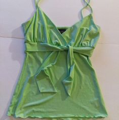 Brand: Inc International Concepts Item: Asymmetrical Spaghetti Strap Tank Top Condition: New Without Tags; Kept In Amazing Condition Size: Large, Grande Color: Green; Mint Green, Pastel Lime Shade Design And Features: Front Bow Tie At The Bust Snithced At The Bust Flowy Bottom V Neckline Hits At Waist Length Not Short, Not Crop Length 95% Polyester 5% Spandex Machine Wash Cold Gentle Cycle With Like Colors Only Non-Chlorine Tumble Dry Medium Bundle With Other Camis And Sleeveless Tanks For A Gre Summer Cotton V-neck Camisole, Green Cotton V-neck Tank Top, Summer V-neck Cotton Camisole, Fitted Green Tank Camisole, Green V-neck Summer Camisole, Trendy Green Tops With Tank Straps, Trendy Lime Green Summer Tops, Green Tank Strap Camisole For Spring, Green Cotton Camisole With Tank Straps