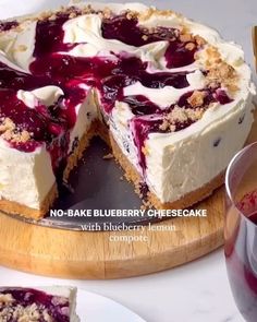 no - bake blackberry cheesecake with blueberry lemon compote on a wooden platter