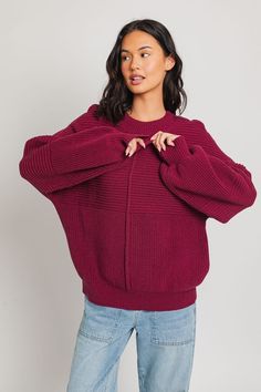 Our Ribbed Knitted Sweater is the ideal wardrobe piece for the winter season. Its banded cuffs and balloon sleeves provide fashion-forward flair, while its ribbed knit texture provides a slimming silhouette to flatter any figure. Sweater has an intentionally oversized, relaxed fit. Model is wearing a small. Recommended sizing 0-2 XS, 4-6 S, 6-8 M, 10-12