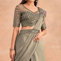 Grey colored stitched saree is made from art silk fabric which is highlighted with sequins embroidered work as shown. comes along with sequins embroidered soft net blouse piece which you can customise as per your design/style. Occasion - You can wear this saree for parties, functions and events. Note:- the actual product may differ slightly in color and design from the one illustrated in the images when compared with computer or mobile screen. Semi-stitched Chinon Party Wear Blouse, Festive Party Wear Pre-draped Embroidered Saree, Navratri Embellished Chanderi Pre-draped Saree, Diwali Sequined Traditional Drape Blouse Piece, Navratri Embellished Chanderi Blouse Piece, Embellished Anarkali Tissue Silk Pre-draped Saree, Party Wear Embroidered Pre-draped Saree For Festivals, Anarkali Style Embellished Tissue Silk Pre-draped Saree, Traditional Drape Sequin Blouse Piece For Diwali