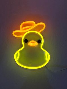 a neon light up duck with a hat on it's head