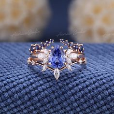 Pear Shaped Cornflower Sapphire Engagement Ring Set 3pcs Art Deco Wedding Rings Women Rose Gold Marquise Diamond Sapphire Wedding Band If you want a men's ring to match this ring, you can take a look at this one. https://www.etsy.com/listing/1535832513/vintage-white-gold-sapphire-mens-rings?click_key= Jewelry Information: ♡ Handmade, high-quality item ♡ Material: SOLID 14K/18K GOLD ( can be made in yellow/white/rose gold ) ♡ Engagement ring ♡ Center stone: Lab grown sapphire  ♡ Size/Weight:  8x6mm  ♡ Cut - Pear Shaped ♡ Color: cornflower blue ♡ Side stones: Moissanite/ Natural diamonds ♡ Weight:  About 0.28ct ♡ Cut - Marquise Shaped ♡ Clarity - SI-VS ♡ Color- G-H ♡ Band Width: Around 1.8mm ♡ Wedding band 1 (top) ♡ Stone: Natural light blue sapphire ♡ Weight: About 0.2ct ♡ Cut - Round Shape Cheap Engagement Rings Under 100 Unique, Engagement Rings With Blue Sapphire, Wedding Rings Cinderella, Blue Wedding Rings Sets His And Hers, Engagement Rings For Him And Her, Water Inspired Engagement Ring, Unique Engagement Rings Sapphire Bridal Sets, Natural Rings Engagement, Wedding Ring Gemstone Unique