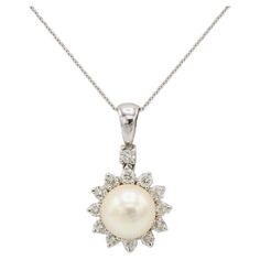 White Gold Cultured Pearl & Natural Diamond Drop Pendant Necklace Metal: 14k & 18k white gold Chain: 18k, 18 inches Pearl: 9mm cultured pearl Diamonds: Approx. 0.65 CTW G VS round natural diamonds Drop: 14K, 24mm Bale opening: 3.5mm Weight: 5.2 grams Diamond Drop Pendant, Drop Pendant Necklace, White Gold Chains, Modern Necklaces, Diamond Drops, Pearl Diamond, Drop Pendant, Metal Necklaces, Natural Pearls