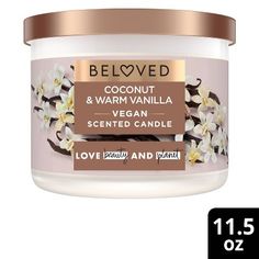 a jar of coconut and vanilla scented candle on a white background with the label below it