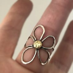 Fantastic handcrafted Sterling silver flower rings that are made to order in your size. They are handmade individually out of Sterling silver wire, oxidized for dimension and polished to high shine. These little pieces of art are relatively flat, mold around your finger and are see through, kind of like lace is. You will love this ring if you like big, handmade jewelry, that is comfortable to wear. These rings don't come from a mold. I make them individually out of wire. They are all very simila Unique Adjustable Flower-shaped Jewelry, Handmade Yellow Gold Flower Ring, Handmade Flower Shaped Promise Ring, Artistic Open Ring Jewelry For Gifts, Hand Forged Fine Jewelry Rings As Gift, Unique Flower-shaped Jewelry For Anniversary, Unique Flower Ring For Anniversary, Gold Sterling Silver Rings With Unique Design, Unique Flower-shaped Anniversary Jewelry