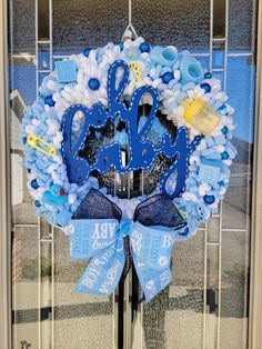 a blue and white wreath with an anchor on it