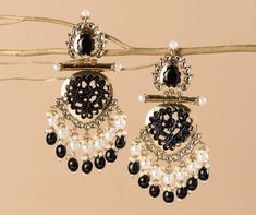 Our Indian earrings is Gold plated, & created with careful attention to detail. The color combination and finishing gives it an elegant look and feel. This design is perfect for parties & functions as these earring are specially designed for Indian beautiful brides -Base Metal- Alloy -Plating- Gold -Stone- Earrings & Mirrors -Sizing-Non Adjustable -Type- Chandbali Earrings -Light Weight -FREE Shipping -Gift Wrapping Available -Delivery from a Small Business in India -Handmade Product Skin Friendly- Lead & Nickel Free in compliance with all International Requirements. Gift- Ideal Valentine, Birthday, Anniversary gift for someone you Love/ Best Friend/Girlfriend. Occasion- Festivals, Wedding, Party Wear, Perfect For Indian weddings We tried to cover as many details as possible in our picture Elegant Black Danglers For Festive Season, Elegant Black Danglers For Festive Occasions, Elegant Black Earrings For Festive Occasions, Elegant Black Festive Earrings, Elegant Festive Black Earrings, Festive Elegant Black Earrings, Black Dangle Earrings For Festive Occasions, Elegant Black Danglers For Gift, Elegant Black Jewelry With Latkans