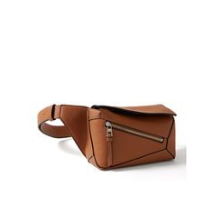 Loewe's belt bag is a bitesize version of its iconic 'Puzzle Edge' design. It's been made in Spain from panels of smooth leather and lined in herringbone cloth to protect your belongings. The strap is adjustable, so you can wear it around your waist or on the shoulder. Modern Leather Belt Bag For Work, Designer Leather Belt Bag With Removable Belt, Leather Belt Bag With Removable Pouch For Work, Modern Leather Shoulder Bag With Removable Belt, Modern Business Bags With Removable Belt, Modern Crossbody Belt Bag For Work, Modern Shoulder Bag With Removable Belt, Modern Brown Bag With Removable Belt, Modern Leather Belt Bag