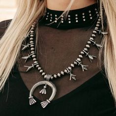 Get ready to wrangle your style with the Tribal Cowgal necklace! Featuring trendy faux pearls and a lucky silver horseshoe dangle, this unique piece will add a playful touch to any outfit. Perfect western jewelry for the rodeo, country music concert, festival or trip to Nashville with your best friends. So saddle up and add a touch of charm to your wardrobe with this must-have squash blossom style accessory. Yee-haw! Length 13" 3" adjustable chain Western Style Silver Jewelry With Silver Beads, Nickel Free Western Style Necklaces, Western Style Nickel Free Necklaces, Nickel-free Western Style Necklaces, Bohemian Necklaces For Western-themed Events, Southwestern Necklaces For Western-themed Events, Western Style Silver Metal Jewelry, Western Silver Metal Jewelry, Silver Metal Western Necklace