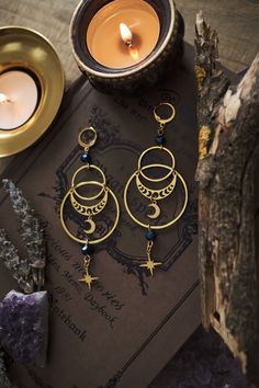 * Stunning statement Moon and Stars earrings which will give your outfit a mystical touch.  * These beautiful dangling earrings have a witchy, bohemian feel to them. * Stainless steel! * The total length of the earrings is approximately 10 cm (aprox 4 inches), hook included.  * They come in a pretty little pouch 🖤 *Matching necklace available: https://www.etsy.com/listing/1736069481/celestial-necklace-with-moon-and-star Celestial Whimsigoth, Celestial Goth, Witchy Boho, Stars Earrings, Celestial Earrings, Moon And Star Earrings, Celestial Necklace, Witchy Jewelry, Celestial Jewelry