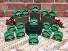 a group of green hats sitting on top of wooden boxes