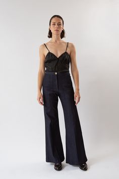 The Darby is our best-selling high-waisted, flared stretch denim pant with front patch pockets and a pintuck stitched down front of each leg. With a subtle 70's svelte silhouette, Darby fits the figure beautifully. Pairs perfectly with slouchy sweaters, fitted blazers, or a simple tee or silk camisole. Erica Tanov This garment is made of a raw denim that has been left in its pure, untreated state. To avoid dye transfer, we recommend an initial separate cold water wash and line dry, which will re Erica Tanov, Stretch Denim Pants, Slouchy Sweater, Silk Camisole, Simple Tees, Silk Slip Dress, Dark Indigo, Raw Denim, Fitted Blazer