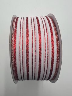 red and white striped ribbon with sequins on the edge, spooling