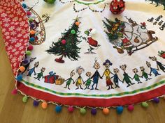 a christmas table cloth with cartoon characters on it