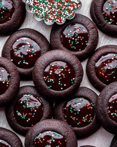 chocolate covered cookies with sprinkles on a table