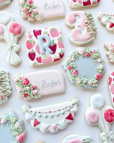 decorated cookies are displayed on a white surface