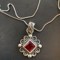 The Chain Is .9gm In Weight Marked 14k And The Pendant Is Vintage Not Sure If It Is Ruby Or Garnet Color Stone It Looks Darker In Less Light And Brighter Like A Ruby In More. Chain Is 18 Inches As Pictured. Pendant Is Sterling And Marked Also As Pictured 925. Red Square Pendant Jewelry For Formal Occasions, Silver Ruby Jewelry For Gift, Red Sterling Silver Jewelry With Birthstone, Sterling Silver Jewelry With Red Birthstone, Traditional Sterling Silver Jewelry With Box Chain, Traditional Sterling Silver Box Chain Jewelry, Formal Red Square Pendant Necklace, Red Engraved Round Necklaces, Classic Red Engraved Jewelry